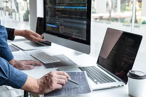 Web Developers Reviewing Code